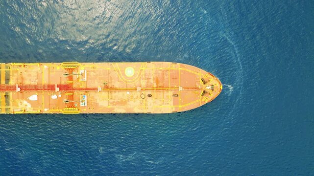 Top down drone footage showing an Iranian oil tanker passing by mid sea