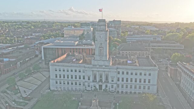Barnsley Town Hall dominates Barnsley town center, South Yorkshire, England, aerial sunset shot above Church Street civic district, Centenary Square, Experience Barnsley Museum, and redevelopment area