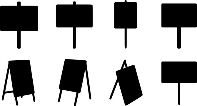 Set of eight black silhouette icons of signboards and display stands including pole-mounted signs, A-frame sandwich boards, and easel displays for advertising and retail design