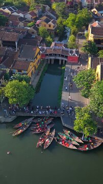 Aerial view of Chua Cau or Japanese Covered ancient Bridge and River in Old city of Hoi An, Vietnam. One of the most travel popular touristic destinations, UNESCO world heritage 