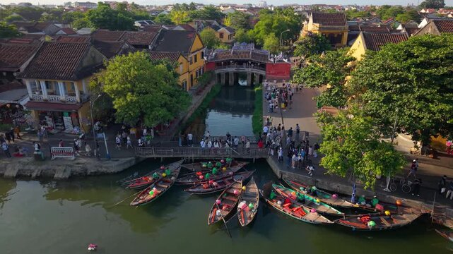Aerial view of Chua Cau or Japanese Covered ancient Bridge and River in Old city of Hoi An, Vietnam. One of the most travel popular touristic destinations, UNESCO world heritage 