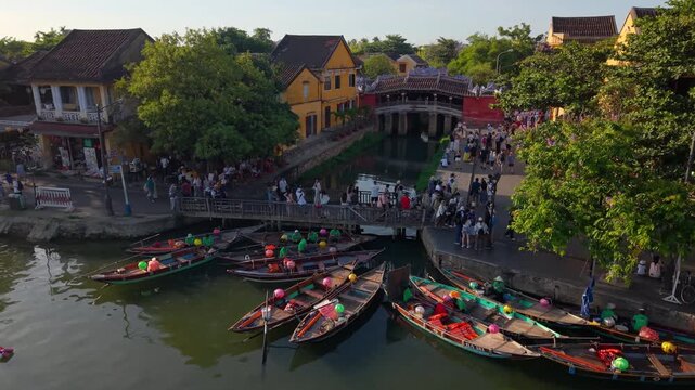 Aerial view of Chua Cau or Japanese Covered ancient Bridge and River in Old city of Hoi An, Vietnam. One of the most travel popular touristic destinations, UNESCO world heritage 