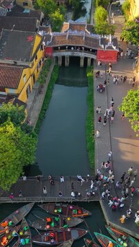 Aerial view of Chua Cau or Japanese Covered ancient Bridge and River in Old city of Hoi An, Vietnam. One of the most travel popular touristic destinations, UNESCO world heritage 