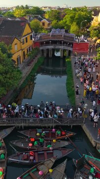 Aerial view of Chua Cau or Japanese Covered ancient Bridge and River in Old city of Hoi An, Vietnam. One of the most travel popular touristic destinations, UNESCO world heritage 