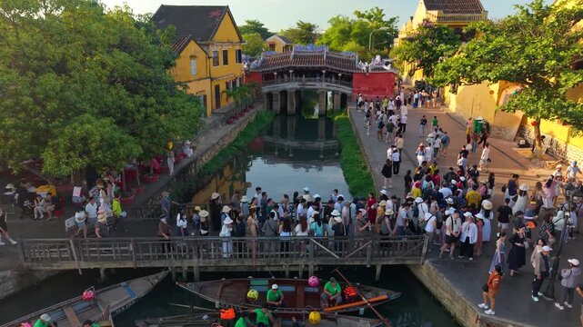 Aerial view of Chua Cau or Japanese Covered ancient Bridge and River in Old city of Hoi An, Vietnam. One of the most travel popular touristic destinations, UNESCO world heritage 