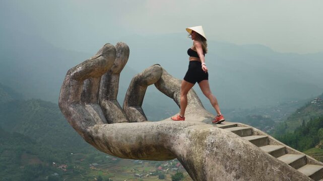 Female Tourist At The Famous Golden Hand Statue At The Moana Sapa Entertainment Complex In Sapa, Vietnam. Slow Motion Shot