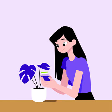 Woman Checking Smart Plant Pot Sensor with Green LED Indicator
