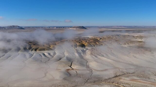 The gentle light of dawn in the Mangistau desert with a view of Mount Bokty