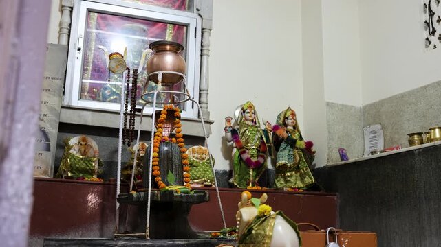 sacred shivling inside hindu temple decorated with garlands and traditional spiritual atmosphere
