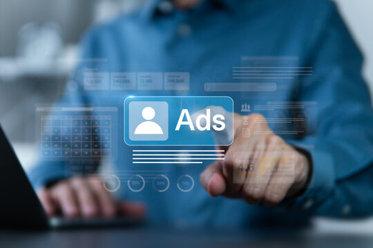 Businessman touching Ads dashboard screen. Digital marketing and social media ads concept. Online advertising, E-commerce, AI, product ads, promotion of products or services through digital tools.