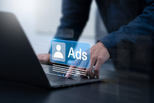 Businessman touching Ads dashboard screen. Digital marketing and social media ads concept. Online advertising, E-commerce, AI, product ads, promotion of products or services through digital tools.