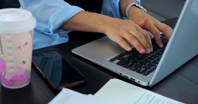 Writer rapidly typing. Freelancer working at home. Someone composing on computer desk. Individual engaged in fast writing on laptop. Person focused on editing and drafting in cozy home workspace