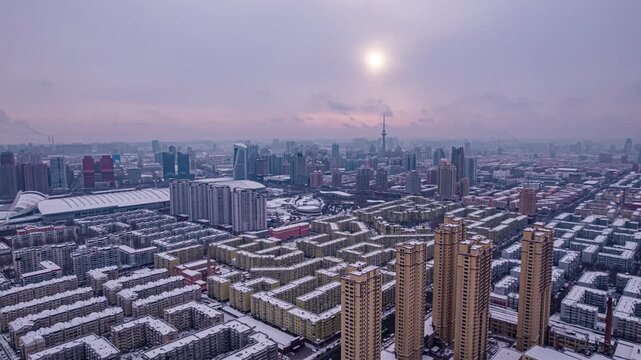 Snow Covered Tianjin City Skyline at Winter Sunrise in Tianjin, China