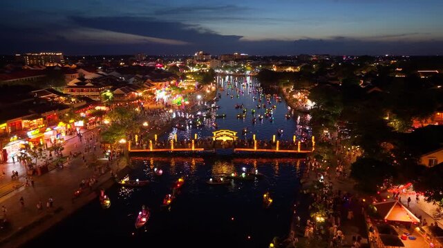 Panorama aerial drone view of Hoi An ancient town with boat tour and beautiful lanterns in sunset. UNESCO world heritage. One of the most travel popular touristic destinations