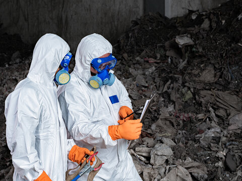 Waste Inspection Team: Safety and Collaboration: Professionals in protective suits work together to assess waste, ensuring safety and environmental responsibility.
