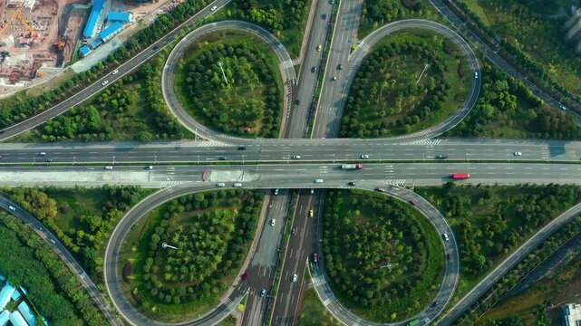 Cloverleaf Highway Interchange with Urban Traffic and Greenery