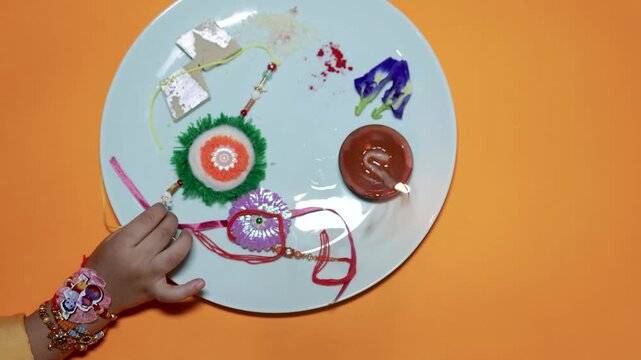 decorative rakhi bracelets arranged on festive plate during raksha bandhan festival