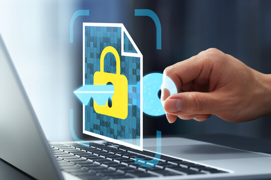 Information security. Encryption key and padlock icons. Secure file storage and data protection. Businessman accessing confidential data on laptop.