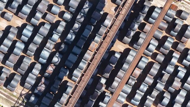 Aerial top down view of steel coils in a factory warehouse