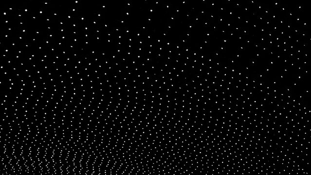 Grid pattern of tiny white glowing lights on black background