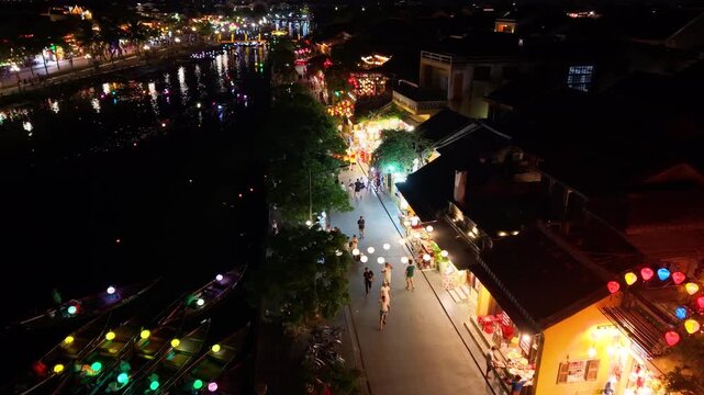 Panorama aerial drone view of Hoi An ancient town with boat tour and beautiful lanterns in sunset. UNESCO world heritage. One of the most travel popular touristic destinations