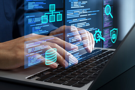 Programmer coding and developing software. Man using with laptop computer to write source code.
