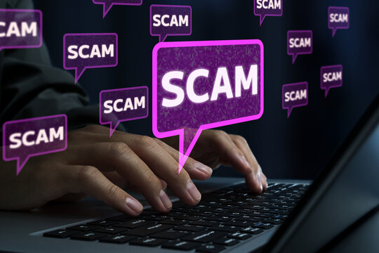 Online scam and internet fraud. Malicious posts and fraudulent advertisements on social media. Scammer using laptop computer.