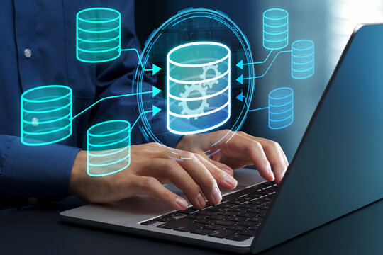 Data warehouse. Integrated database for big data analytics. Businessperson using laptop computer for business intelligence.