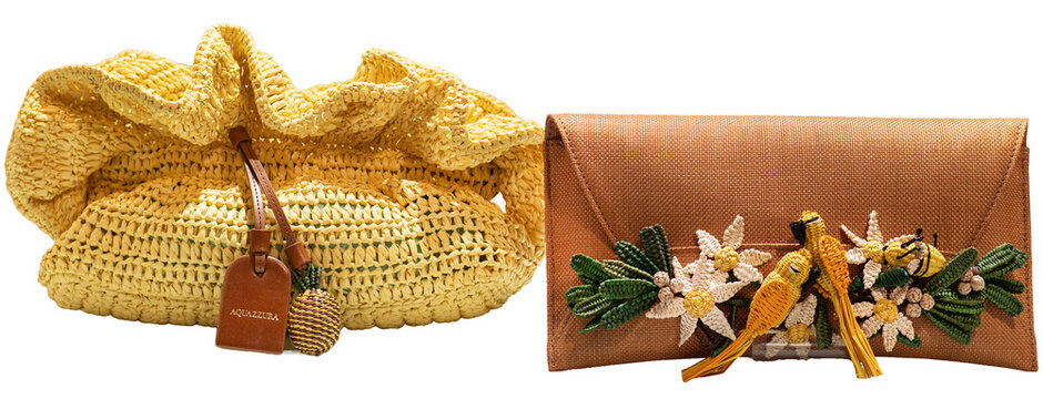 Two stylish haute couture creations by the Italian brand Aquazzurra: a yellow raffia handbag and a Birdsong clutch featuring hand-crafted tropical motifs. Milan, Italy, 27 May 2026