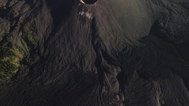 Aerial view of Mt. Barujari lava cone in Segara Anak lake, Lombok, Indonesia