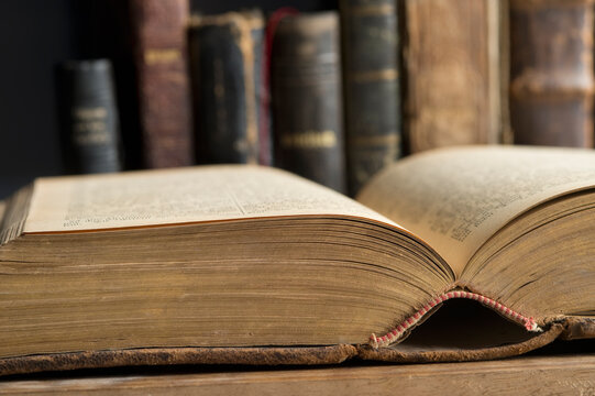 Opened book in a historic library, close-up