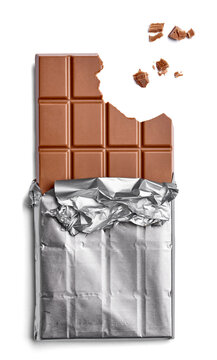 Chocolate bar and crumbs on white background