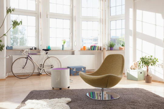 Home interior with bicycle and chair