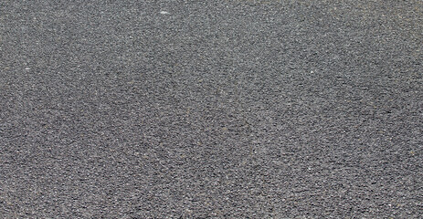 Fototapeta premium Fine dark grey asphalt road surface texture background for transport infrastructure and construction design