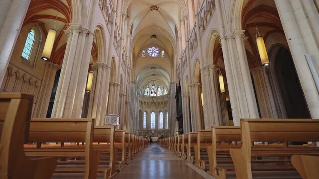 Symmetrical Gothic Cathedral Nave Interior with Wooden Pews in Lyon,30 April 2026.