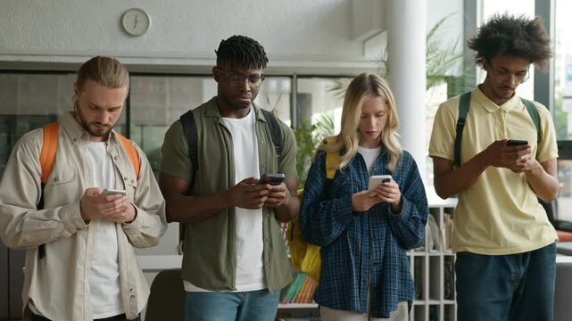 Four gadgets addict focused diversity students scrolling mobile phones African American man looking around shrug shoulders multiethnic friends overuse internet apps social media in university college