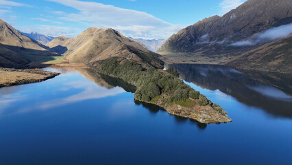 Obraz premium Aerial View of Moke Lake with Mountain Reflections in Queenstown New Zealand
