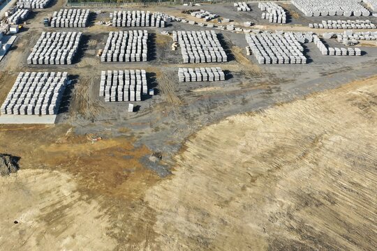Aerial view of organized stacks of concrete building blocks on a construction site or industrial storage yard Beylikduzu, Istanbul, Turkiye.
