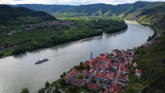 Durnstein Cruise Ship Danube River Wachau Valley Aerial View Village Vineyards Austria Mountain Landscape Opposite Bank Fields Medieval Architecture Blue Church Riverfront Travel Concept UNESCO