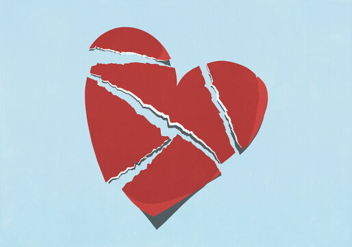 Large broken heart on blue background
