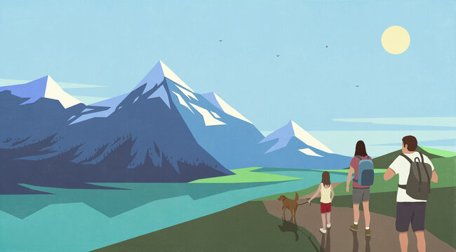 Young family with dog hiking on trail along sunny, scenic mountain lake