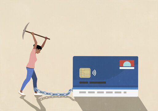 Woman with axe trying to break chain attached to ankle and credit card