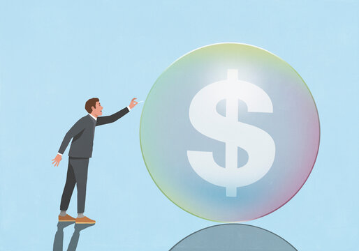 Businessman with pin threatening to pop dollar sign bubble