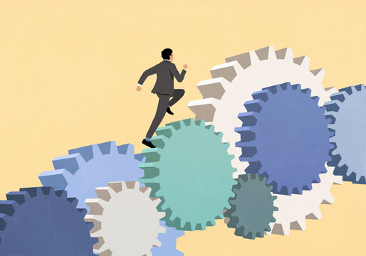 Businessman running up connected cogs