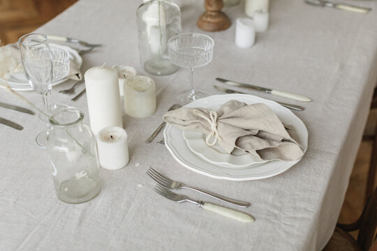 Close-up of a neutral aesthetic elegant table setting for a dinner party