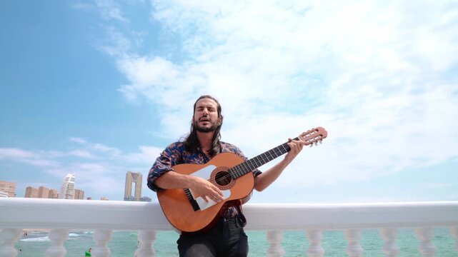Flamenco artist singing and playing guitar in a tight shot with fast dynamic zoom.