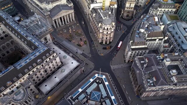 Panoramic aerial overhead view of the City of London skyline with Bank station square and Cornhill during sunset