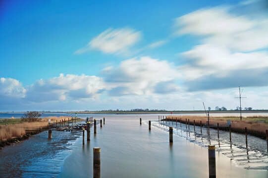 Empty marina on a tributary of the River Ems, Oldersum, East Frisia, Lower Saxony, Germany