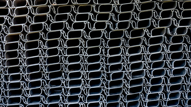 Abstract industrial black plastic sheet piling pattern