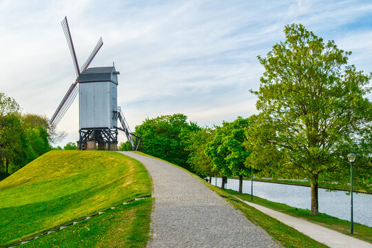 Historic Koeleweimolen windmill along the old ramparts by the canal, (De Vesten), Bruges, Belgium